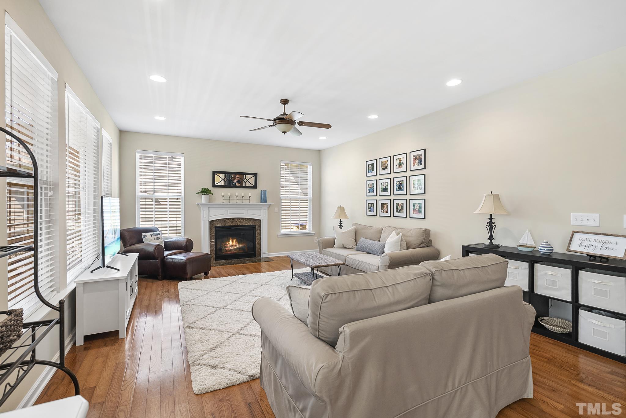 213 Forbes Road Wake Forest, NC 27587 - Photo 9 of 41 a living room with furniture or fireplace and wooden floor