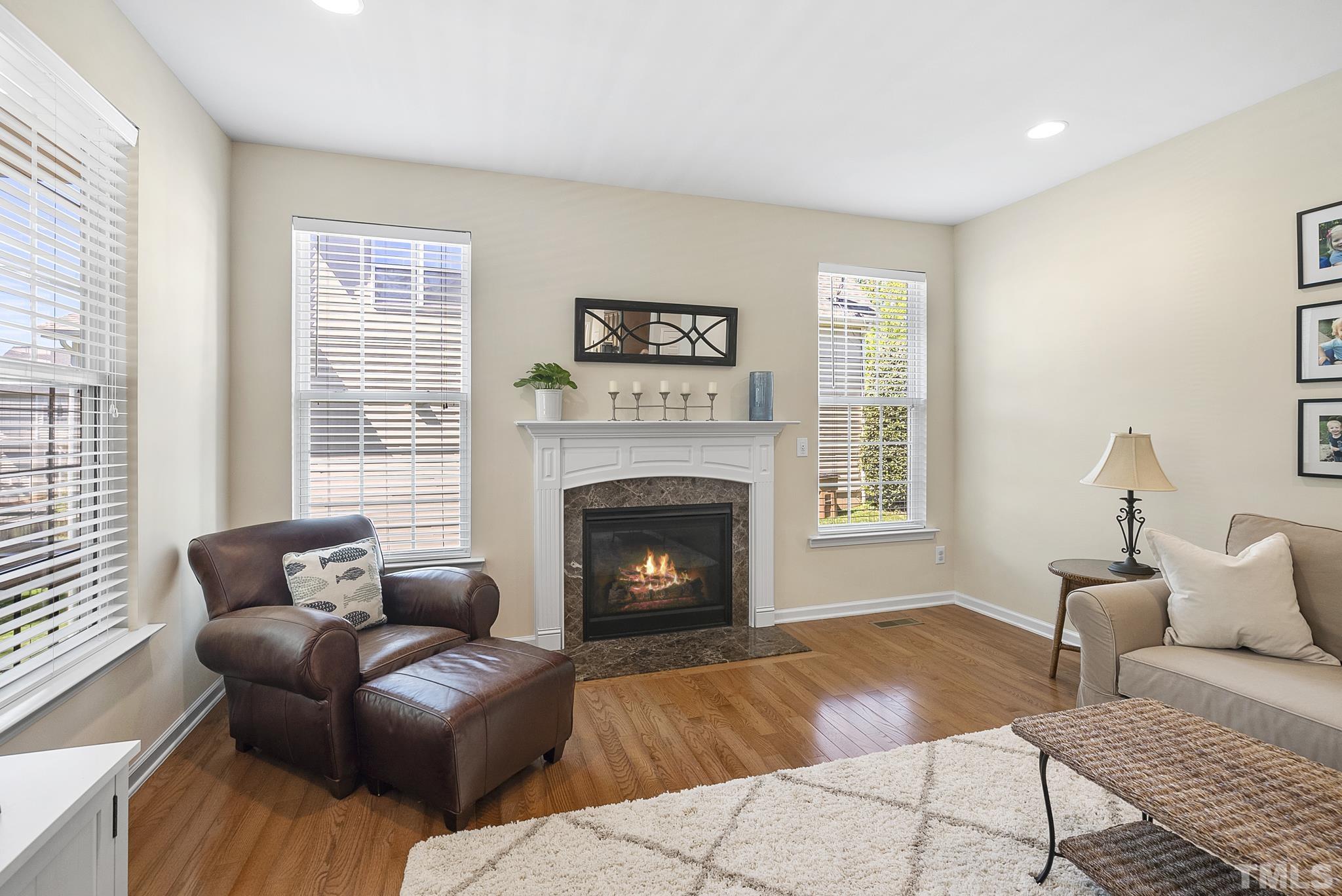 213 Forbes Road Wake Forest, NC 27587 - Photo 10 of 41 a living room with furniture and a fireplace
