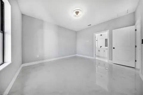 an empty room with windows