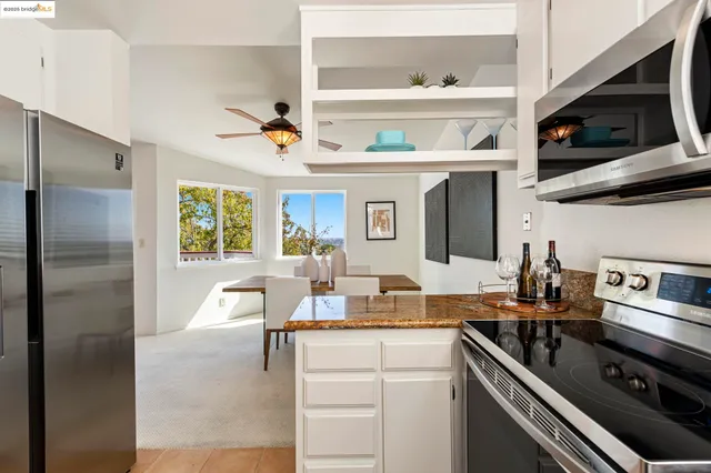 a kitchen with granite countertop a sink and a window