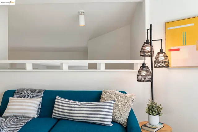 a bedroom with a large bed and a flat tv screen