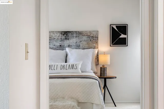 a bedroom with a large bed and a view of bedroom