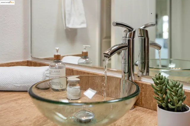 a spacious bedroom with a bed and a large window