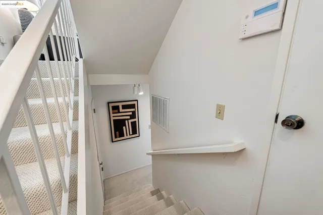 a bedroom with a bed and a table in it