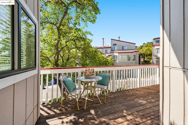 a view of a balcony with chairs