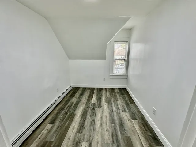a view of wooden floor in an empty room