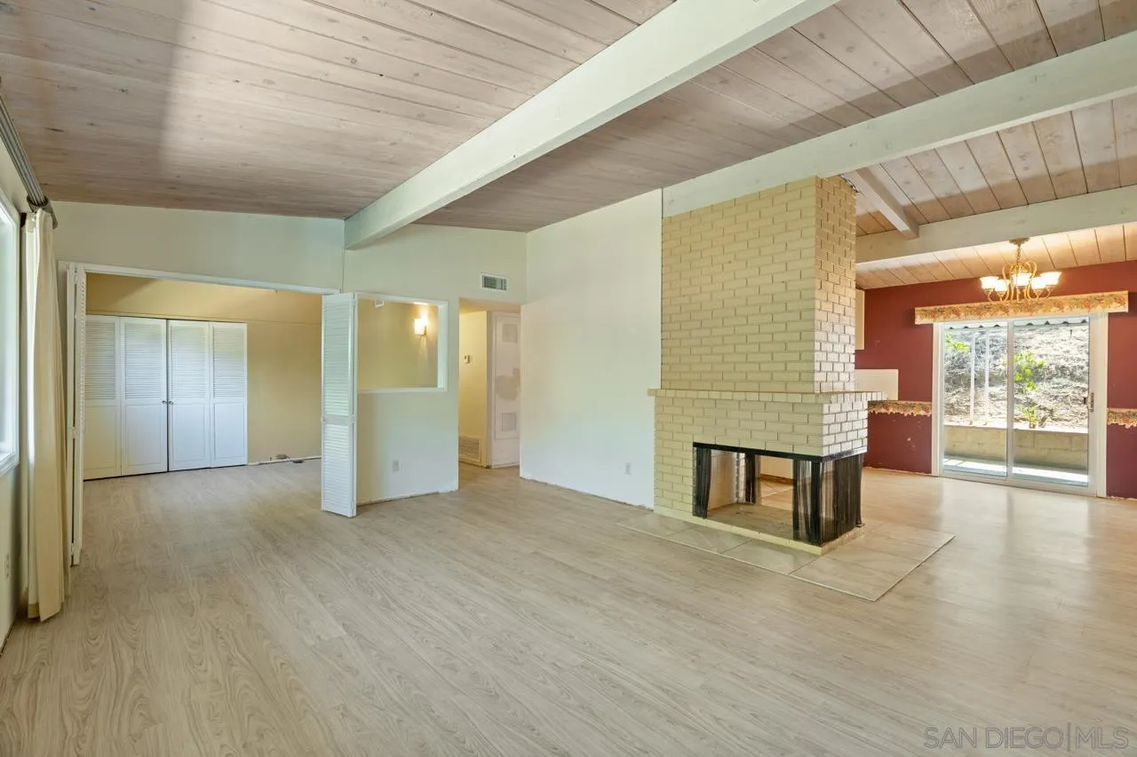 8670 Golden Ridge Road Lakeside, CA 92040 - Photo 11 of 31 a view of an empty room with window and wooden floor
