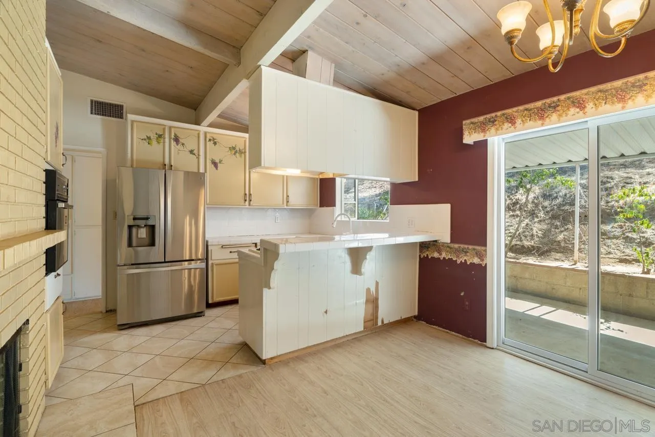 8670 Golden Ridge Road Lakeside, CA 92040 - Photo 18 of 31 a kitchen with a refrigerator and a stove