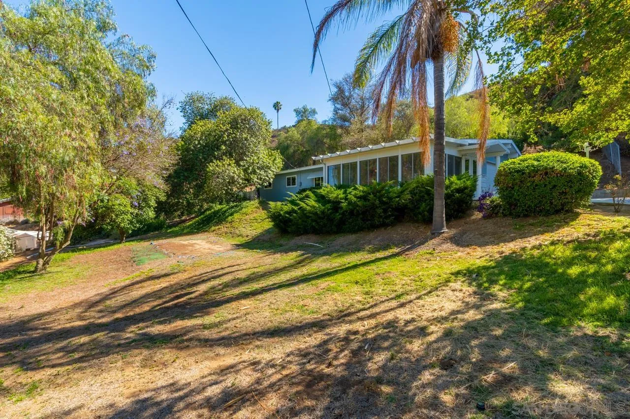 8670 Golden Ridge Road Lakeside, CA 92040 - Photo 2 of 31 a view of a house with a yard and a large tree