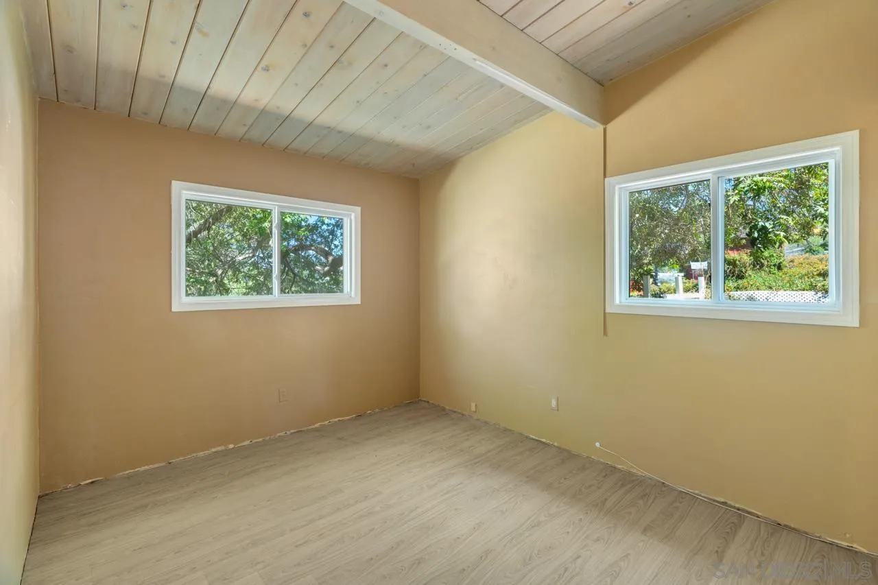 8670 Golden Ridge Road Lakeside, CA 92040 - Photo 26 of 31 a view of an empty room with a window and a ceiling fan