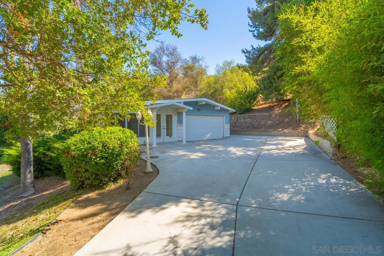 8670 Golden Ridge Road Lakeside, CA 92040 - Photo 5 of 31 a view of a house with a yard