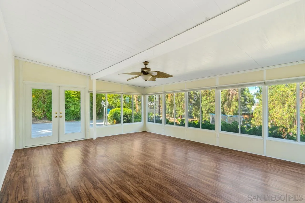 8670 Golden Ridge Road Lakeside, CA 92040 - Photo 8 of 31 a view of an empty room with wooden floor and a window