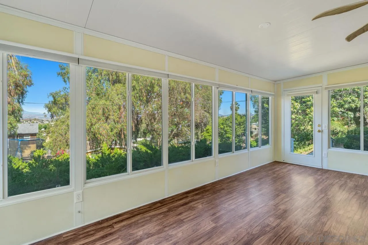 8670 Golden Ridge Road Lakeside, CA 92040 - Photo 10 of 31 a view of room with balcony and wooden floor