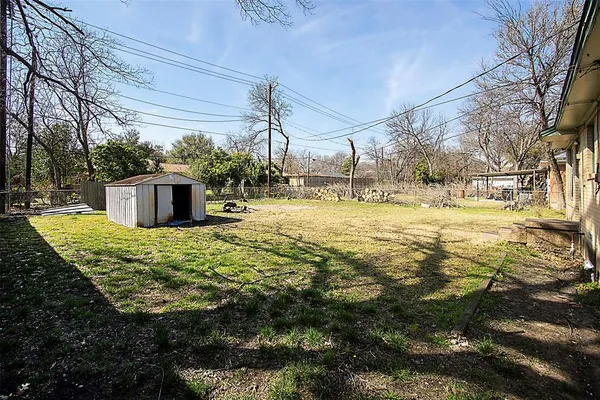 a view of a building with a yard