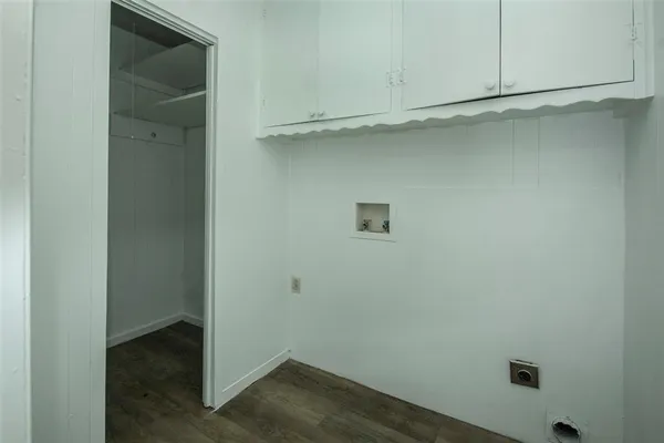 an empty room with wooden floor