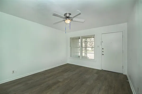 a view of an empty room with a window