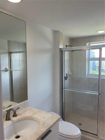 a bathroom with a sink and toilet