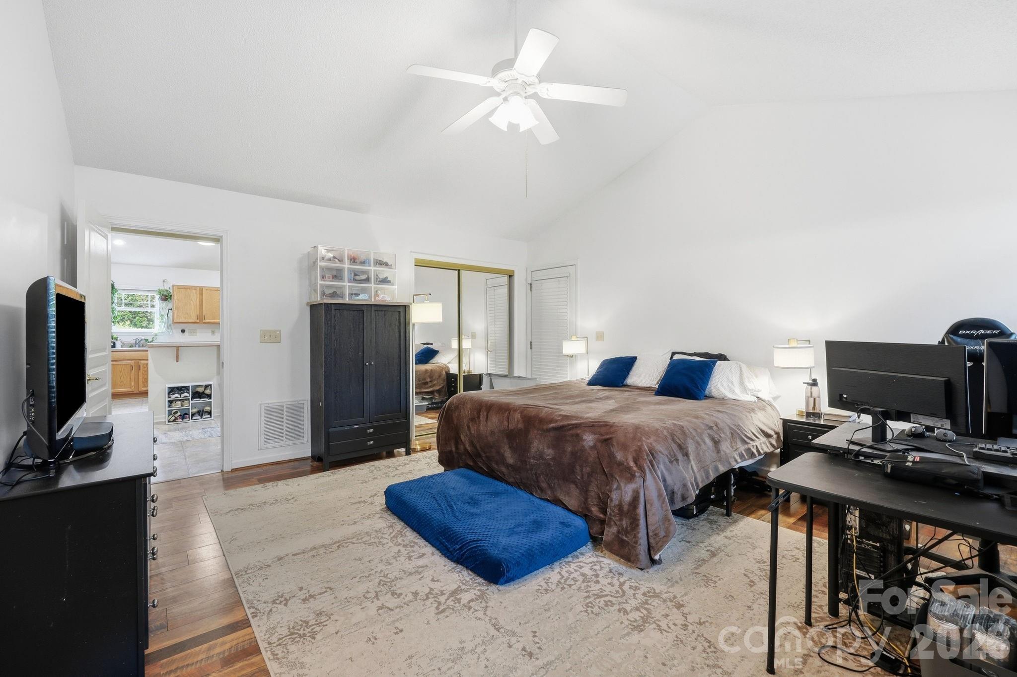 51 Sunview Circle Arden, NC 28704 - Photo 18 of 31 a spacious bedroom with a bed and a flat screen tv