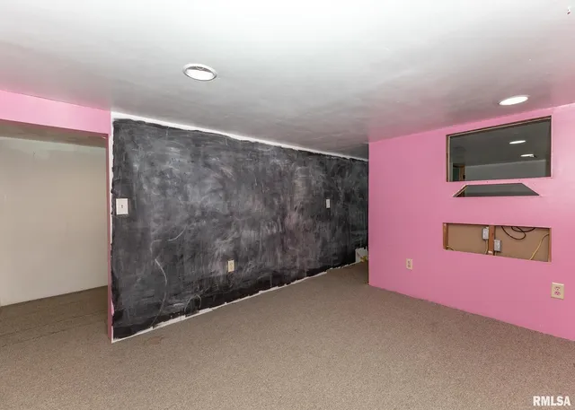 a view of a livingroom with furniture and flat screen tv