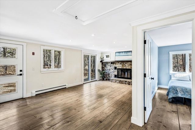 a view of a livingroom with furniture and a flat screen tv