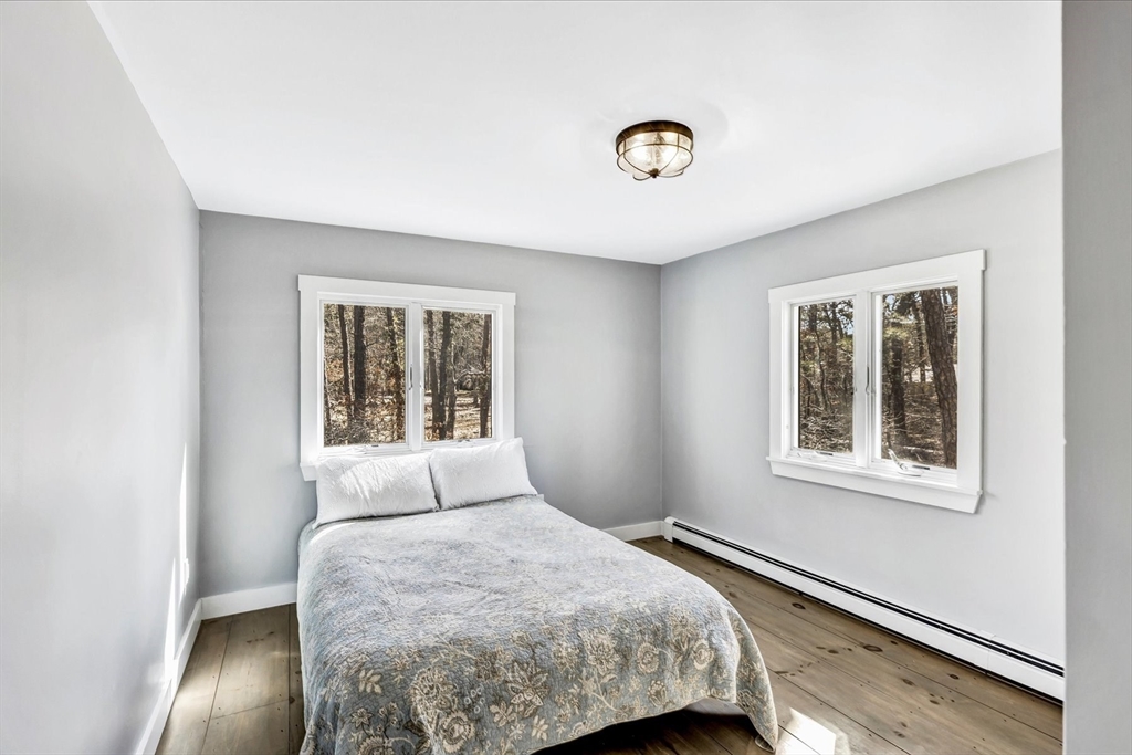55 Howes Road Wellfleet, MA 02667 - Photo 15 of 33 a bedroom with a bed and a window