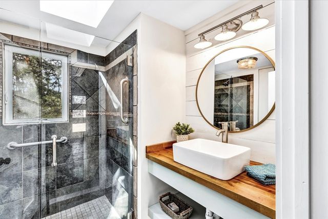 a bathroom with a sink and a mirror