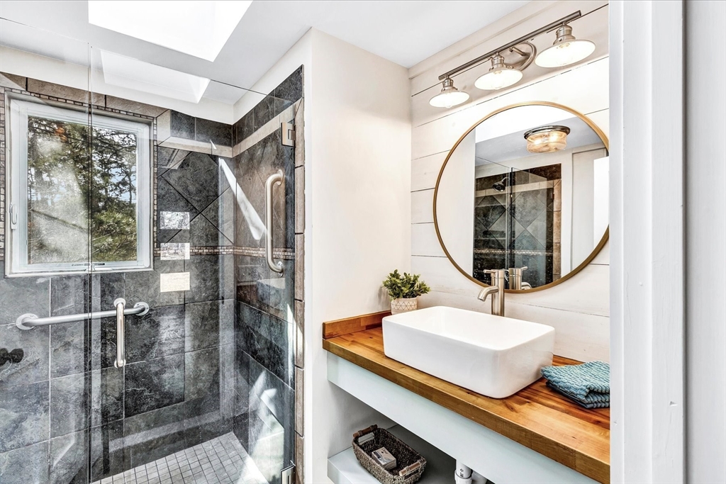 55 Howes Road Wellfleet, MA 02667 - Photo 17 of 33 a bathroom with a sink and a mirror