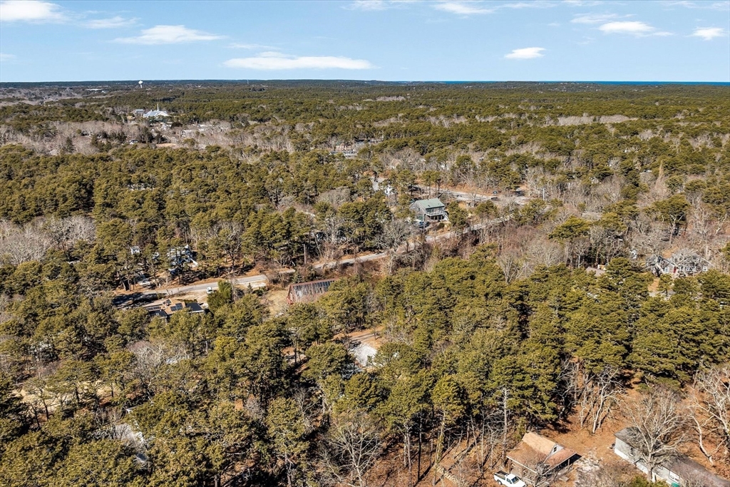 55 Howes Road Wellfleet, MA 02667 - Photo 30 of 33 an aerial view of residential houses with outdoor space and trees
