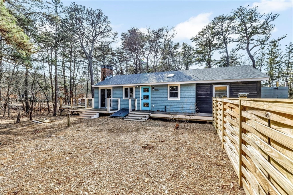 55 Howes Road Wellfleet, MA 02667 - Photo 4 of 33 a view of a house with a yard