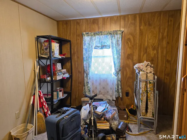 a room with furniture and a book shelf