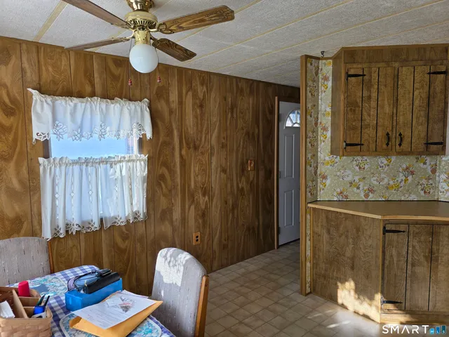 a bedroom with a bed and a mirror