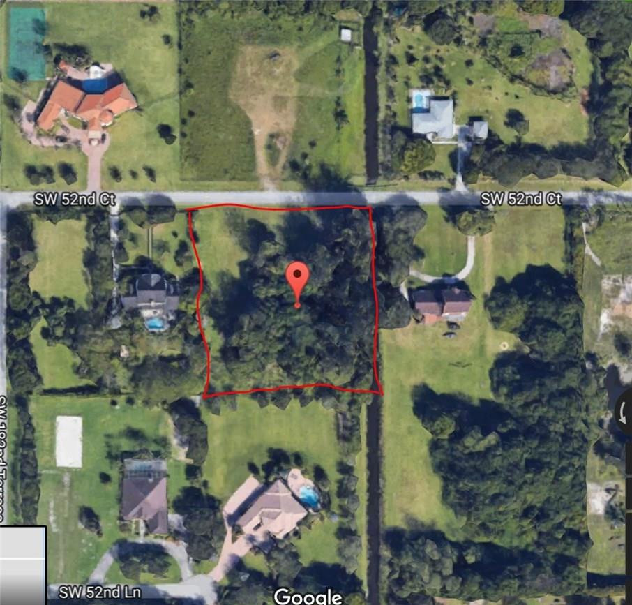 18100 Southwest 52nd Court Southwest Ranches, FL 33331 - Photo 2 of 4 an aerial view of a houses with yard