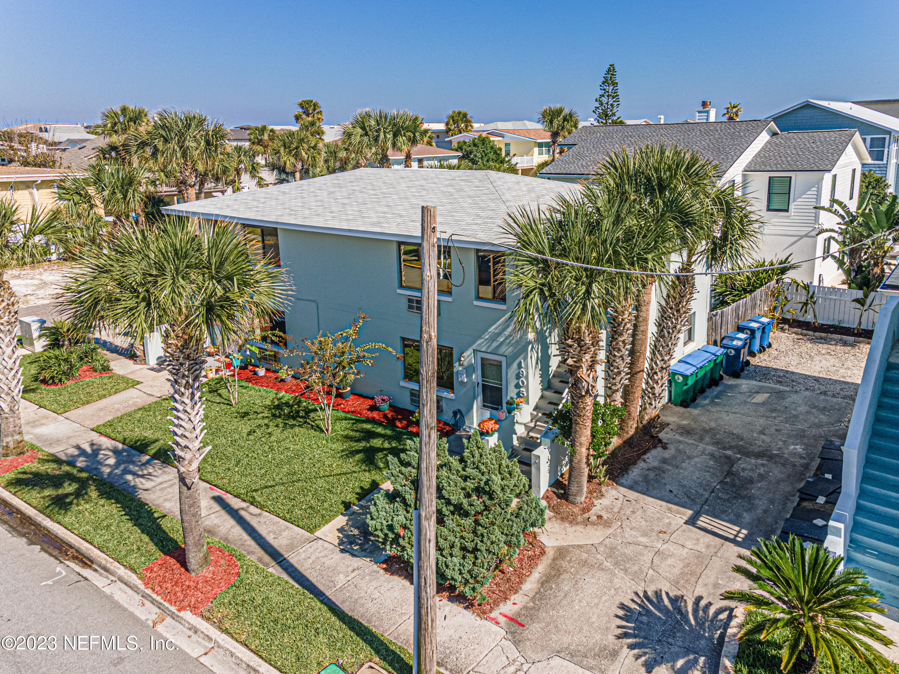 1907 First Street Neptune Beach, FL 32266 - Photo 20 of 29 a aerial view of a house with a yard and potted plants