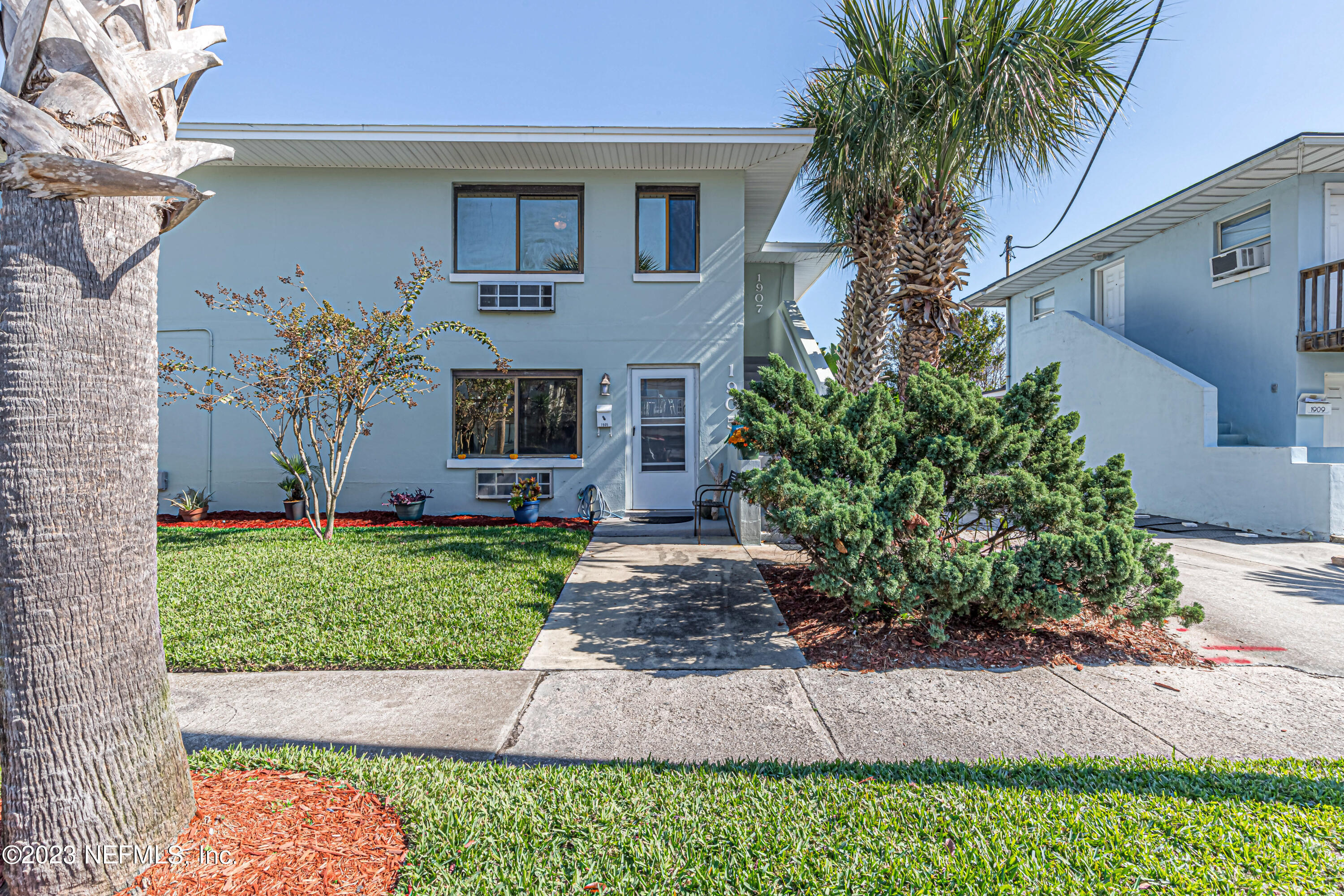 1907 First Street Neptune Beach, FL 32266 - Photo 2 of 29 a front view of a house with garden