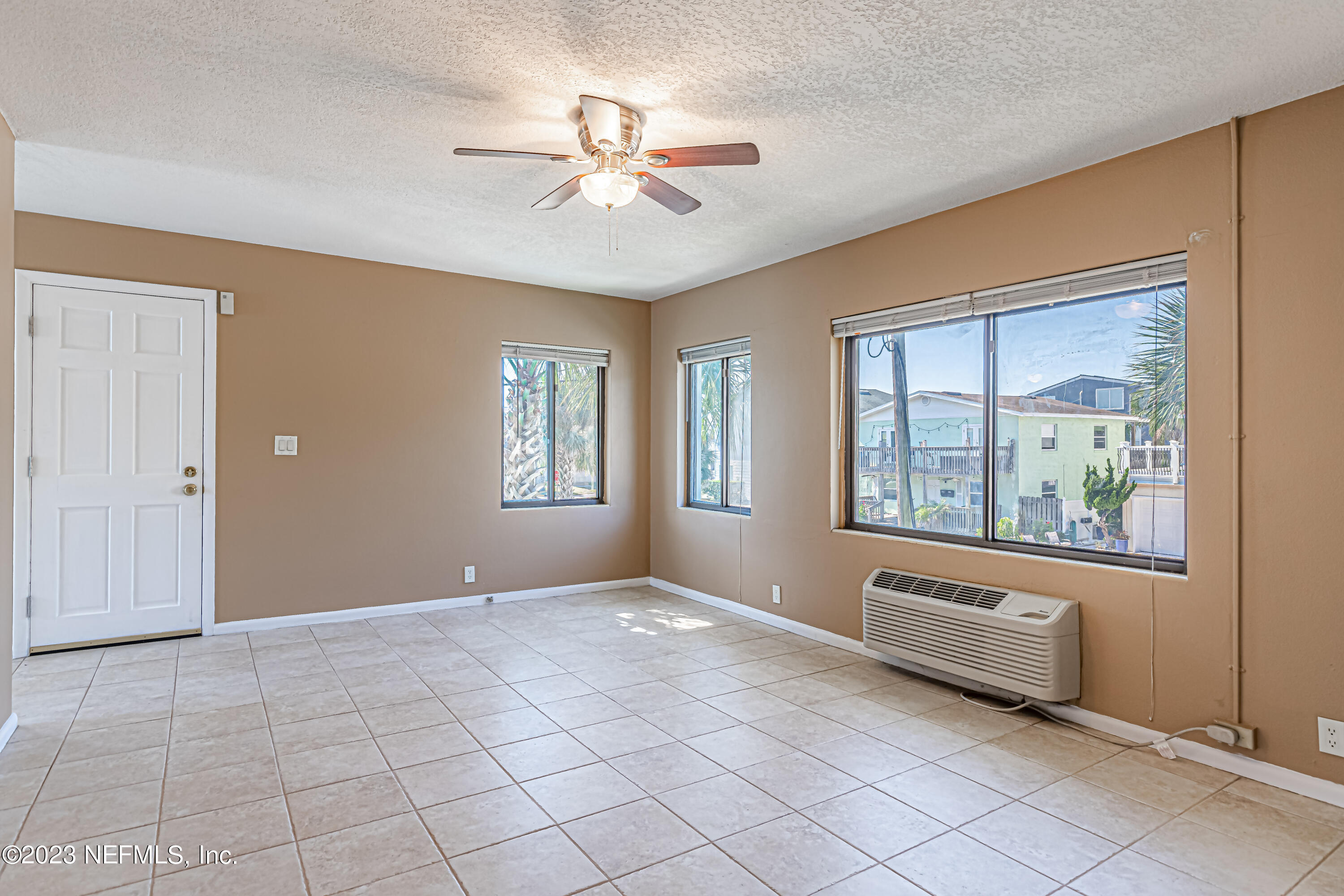 1907 First Street Neptune Beach, FL 32266 - Photo 7 of 29 a view of an empty room with windows