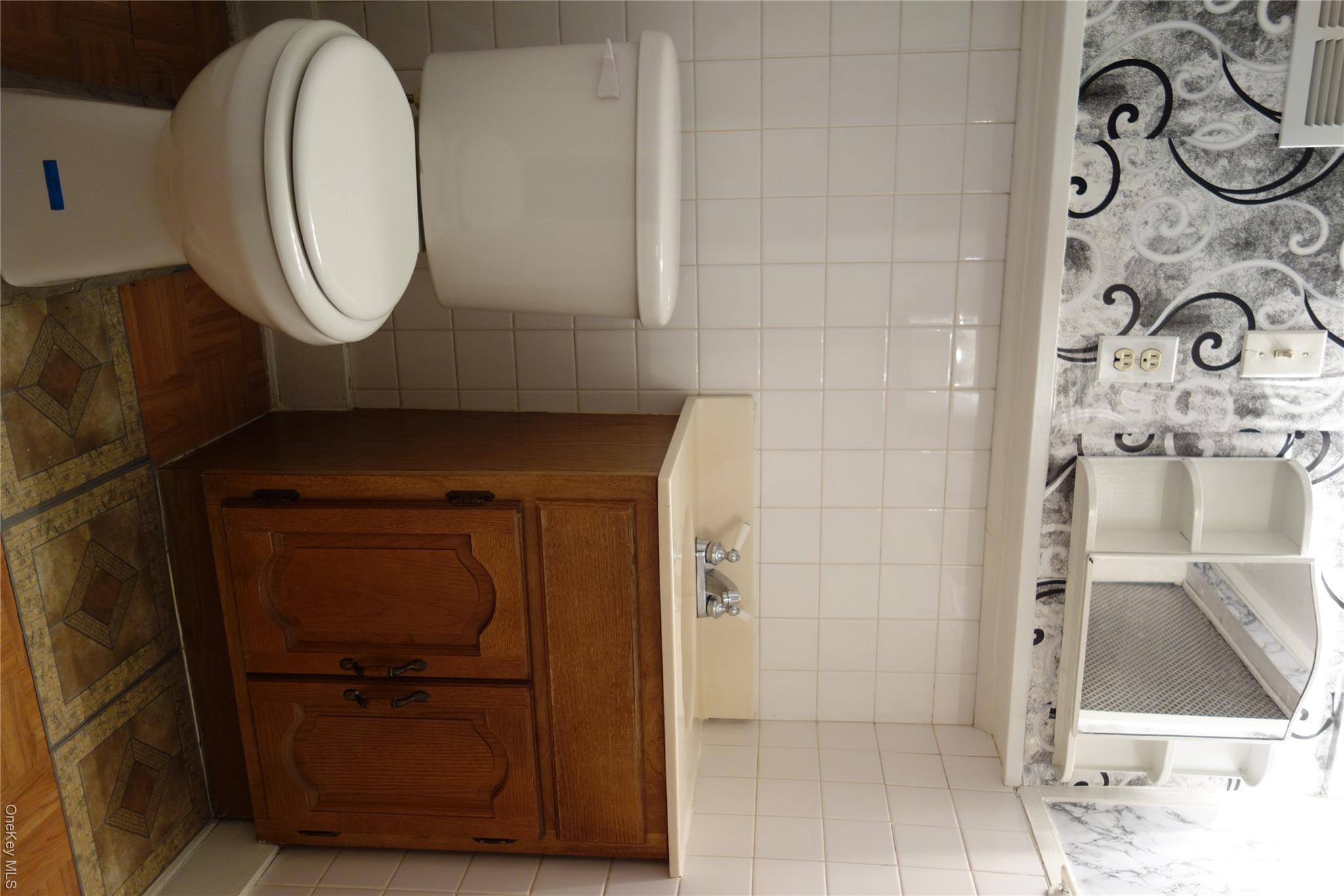 160-11 84th Road Queens, NY 11432 - Photo 22 of 25 Basement Half Bath