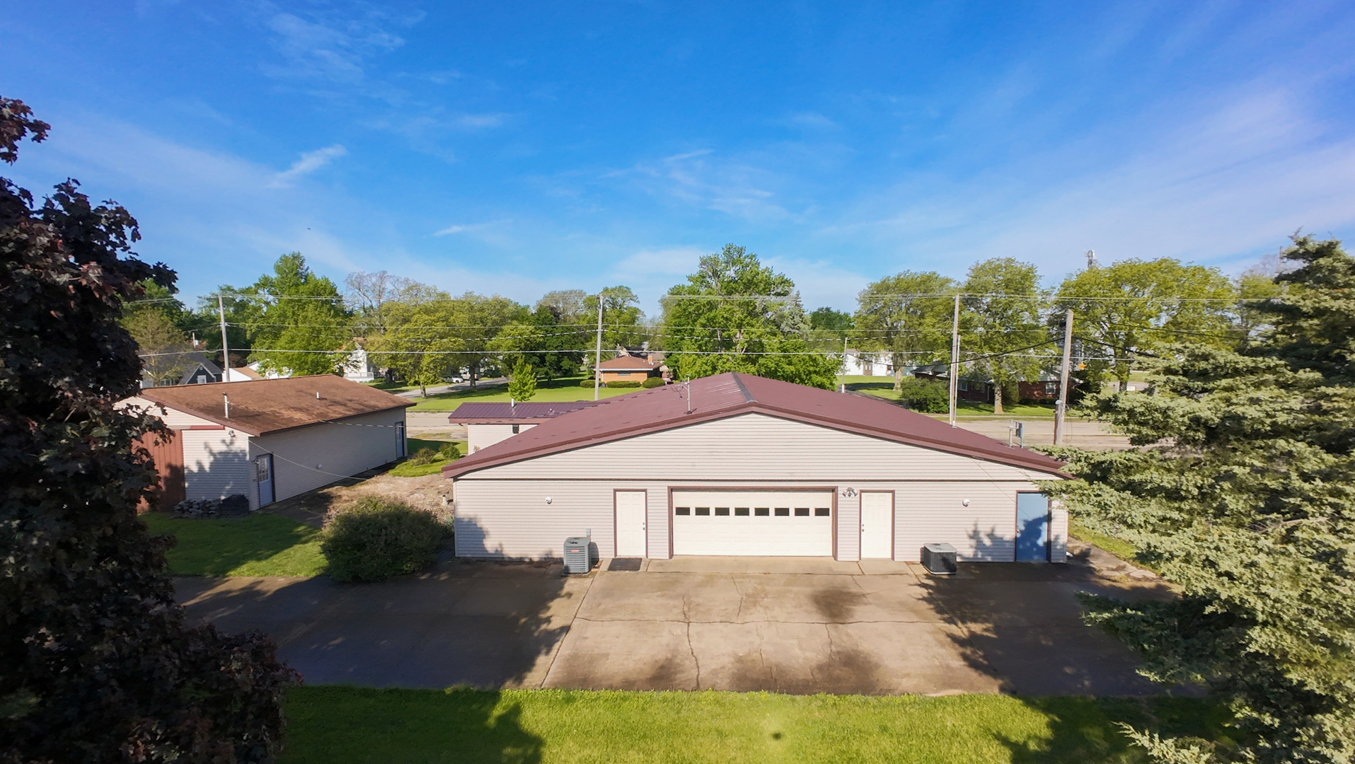 103 South 4th Street Chatsworth, IL 60921 - Photo 16 of 70 a view of a big house with a yard and potted plants