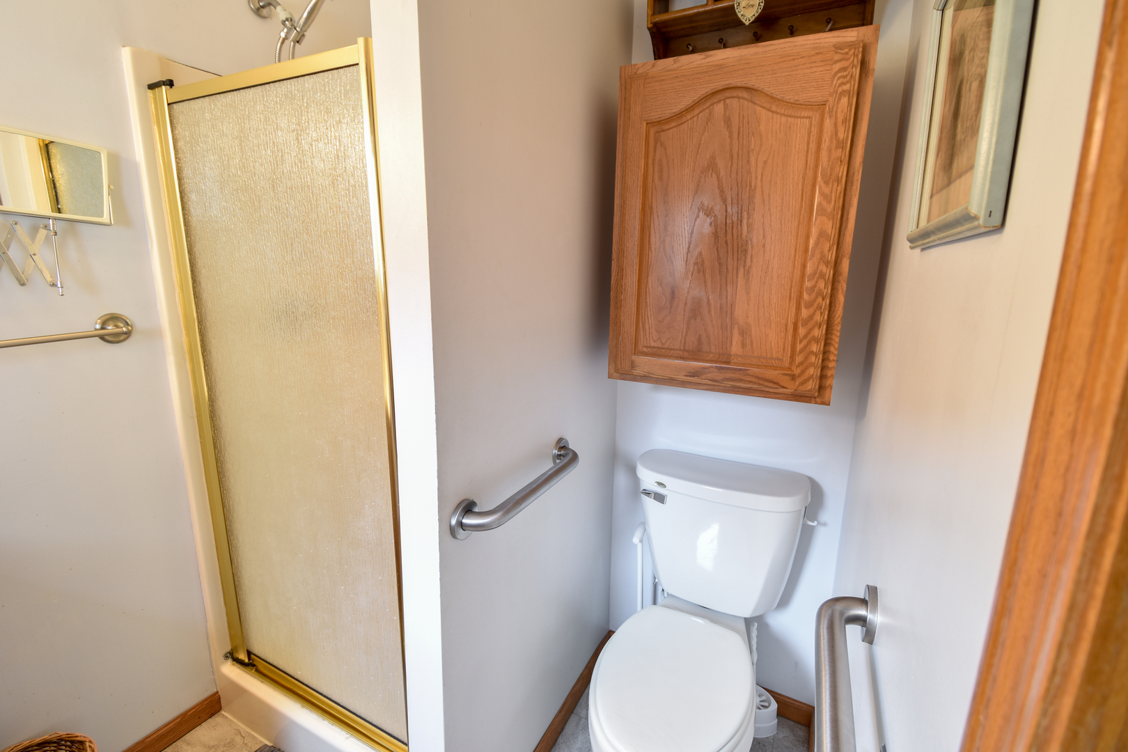 103 South 4th Street Chatsworth, IL 60921 - Photo 43 of 70 a bathroom with a toilet and a shower curtain