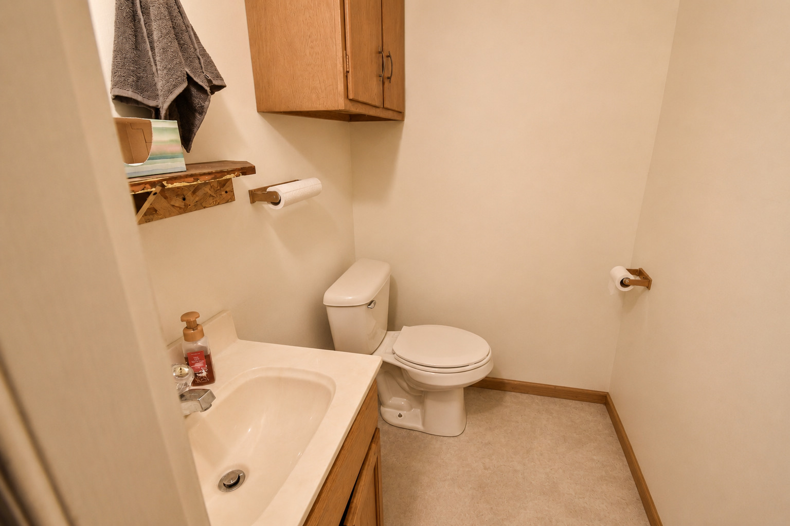 103 South 4th Street Chatsworth, IL 60921 - Photo 67 of 70 a white toilet sitting next to a bathroom sink