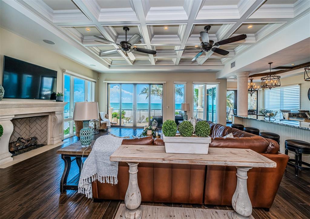 17824 Lee Avenue Redington Shores, FL 33708 - Photo 12 of 98 a view of a dining room with furniture a fireplace and wooden floor