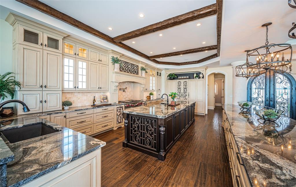 17824 Lee Avenue Redington Shores, FL 33708 - Photo 17 of 98 a kitchen with stainless steel appliances granite countertop a stove and a sink