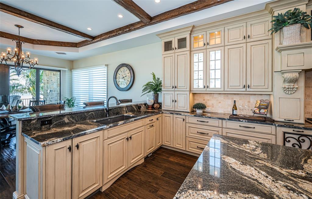 17824 Lee Avenue Redington Shores, FL 33708 - Photo 20 of 98 a kitchen with stainless steel appliances granite countertop a sink and a stove