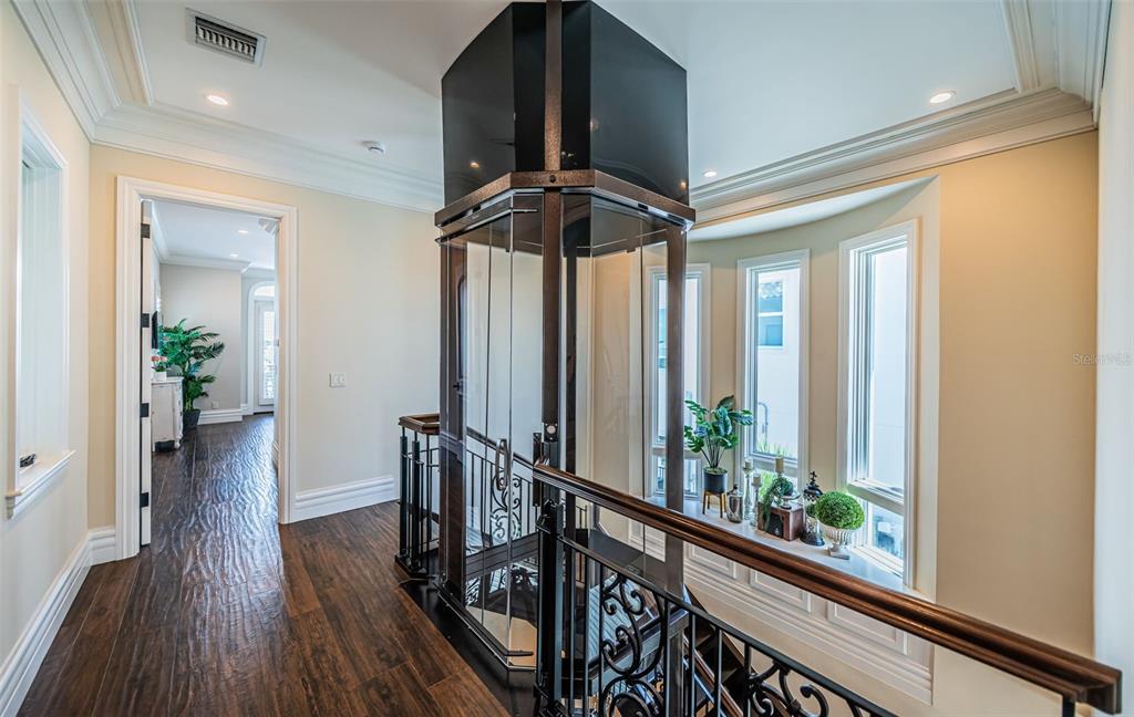 17824 Lee Avenue Redington Shores, FL 33708 - Photo 48 of 98 a view of a hallway with wooden floor and stairs