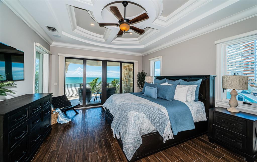 17824 Lee Avenue Redington Shores, FL 33708 - Photo 49 of 98 a bedroom with a bed and a dresser next to a window