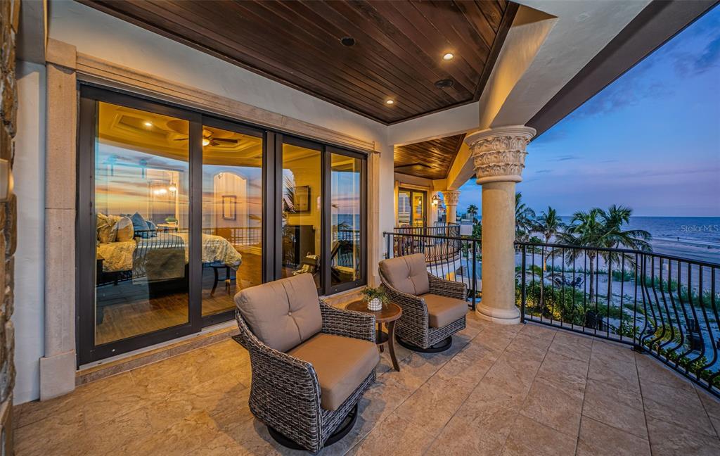 17824 Lee Avenue Redington Shores, FL 33708 - Photo 56 of 98 a living room with furniture and a floor to ceiling window