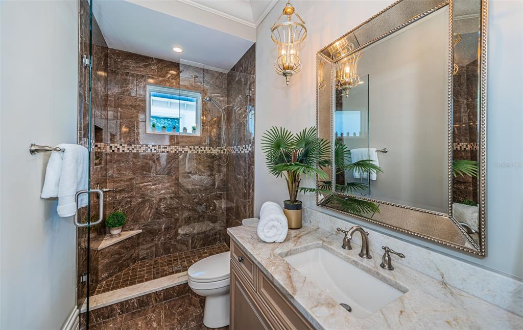 17824 Lee Avenue Redington Shores, FL 33708 - Photo 75 of 98 a bathroom with a sink a toilet and shower