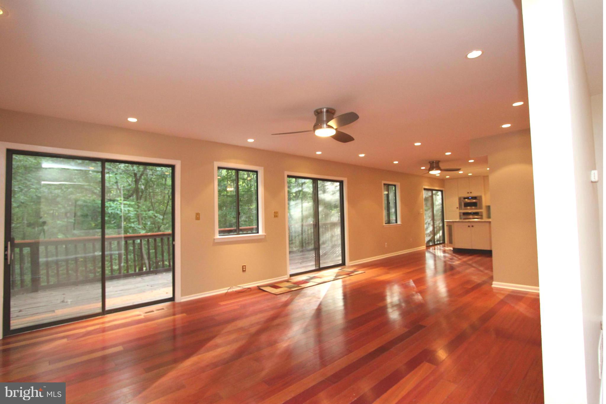 36 Constantine Drive Phoenix, MD 21131 - Photo 2 of 30 a view of an empty room with wooden floor and a window