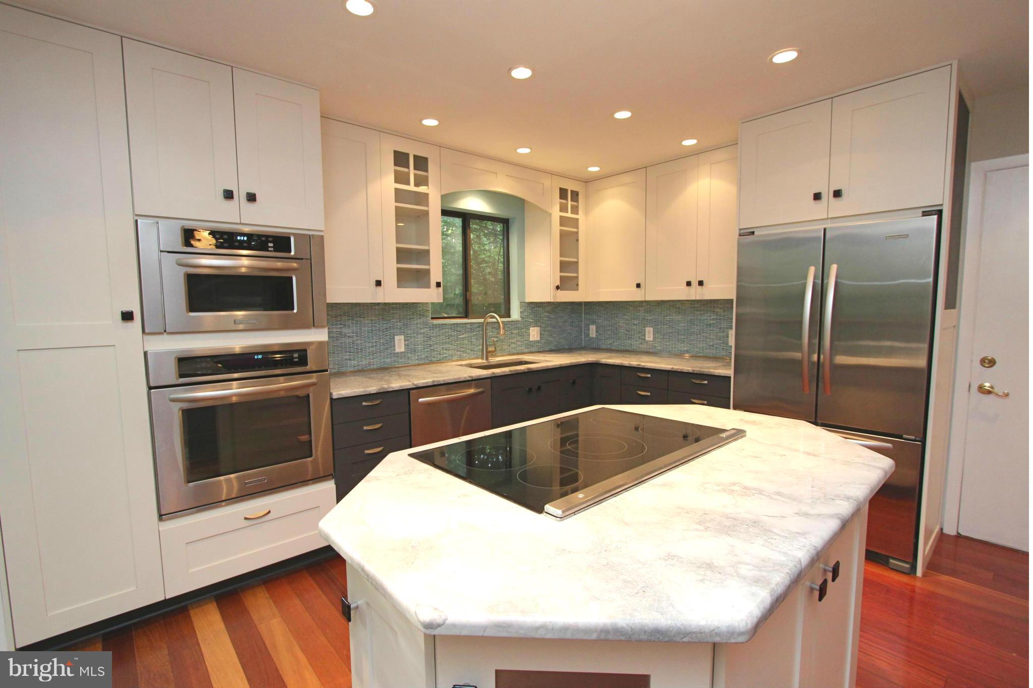 36 Constantine Drive Phoenix, MD 21131 - Photo 7 of 30 a kitchen with granite countertop a sink stove and refrigerator