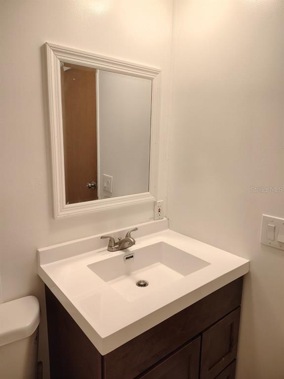 3440 County Road 656 Webster, FL 33597 - Photo 11 of 14 a bathroom with a sink and a toilet