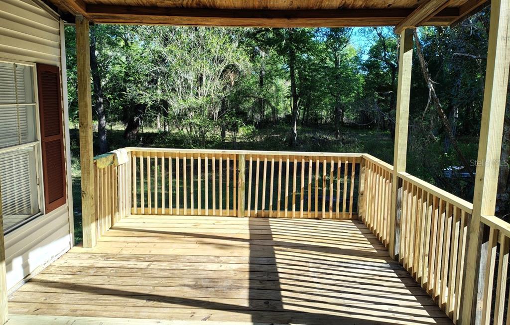3440 County Road 656 Webster, FL 33597 - Photo 3 of 14 a view of porch with wooden floor